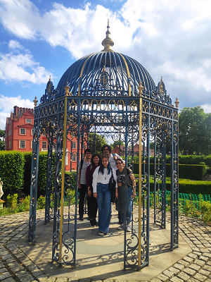 A group of people stood inside a metal structure