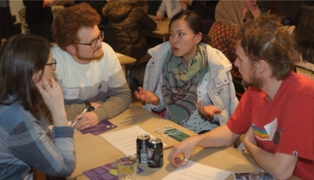 Group of people chatting around table