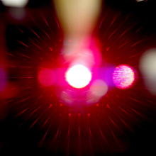 Focal point of a light beam and the diffraction pattern when the 640nm laser of the Flow Cytometry facility’s Influx high speed flow cytometer interact with the sample stream prior to cell sorting. 